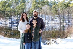picture of Kayly and her family with wooded background used as a profile photo for the honest apron blog